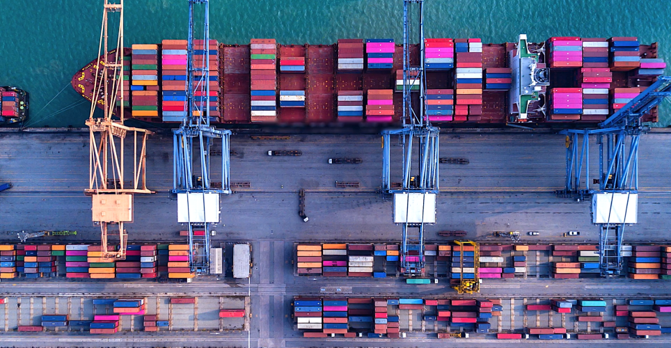 Container port from above. A ship which is just loaded with containers.