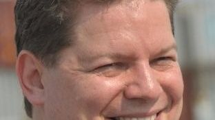 Boris Wenzel smiles at the camera.