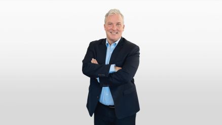 Dr. Lawrence Henesey smiling, ready to lead the sales department, signifying his start in guiding our customers through their digital transformation journeys.