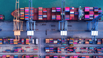 Container port from above. A ship which is just loaded with containers.