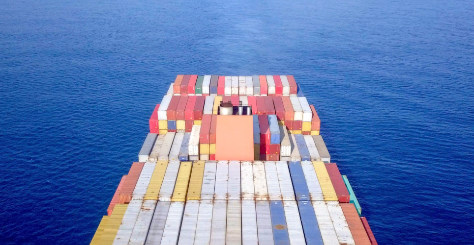 Container ship at sea - Aerial view of a ULVCV (Ultra Large Container Vessel) loaded with various types of containers.