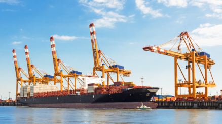 View of the container terminal from the water in bright good weather.