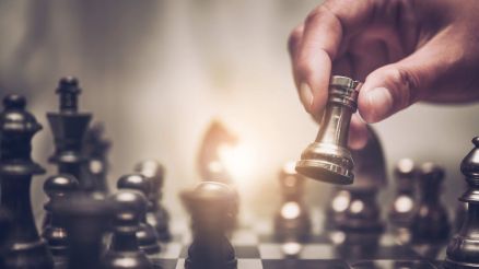 Person playing chess. Symbolism for the CHESSCON brand.