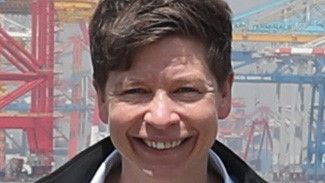 Luisa Kempf in front of a port terminal.