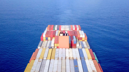 Container ship at sea - Aerial view of a ULVCV (Ultra Large Container Vessel) loaded with various types of containers.