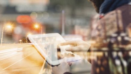 Person informs himself on a tablet about blockchain technology.