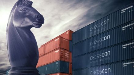 Giant knight chess piece of CHESSCON logo. Behind it containers on which CHESSCON Virtual Terminal is written.