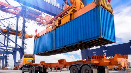 A container is loaded onto a vehicle.